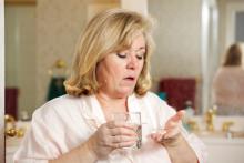 mature woman taking pills.jpg